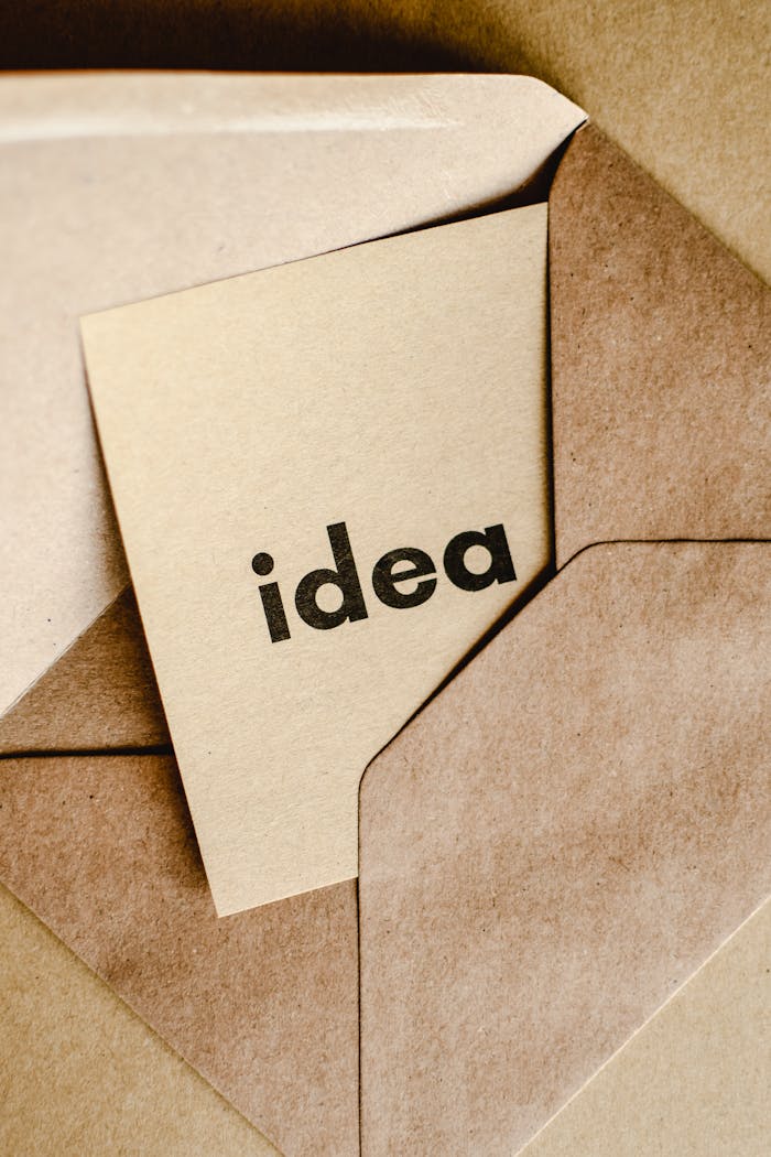 A close-up of a brown envelope containing a card labeled 'idea,' symbolizing creativity and innovation.